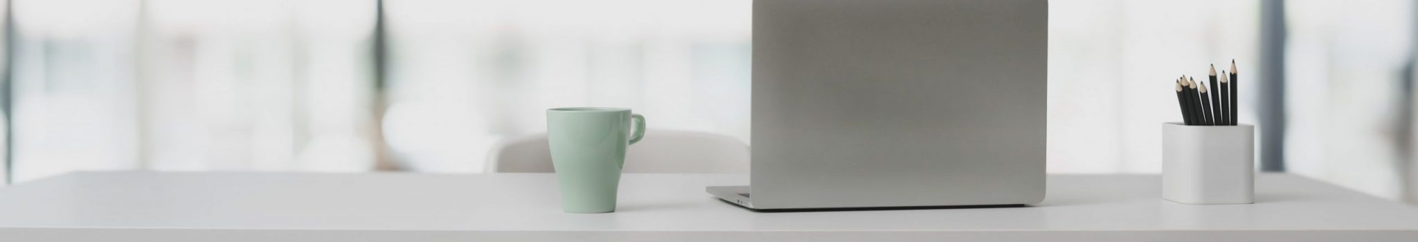 silver-laptop-in-white-wooden-table-3759098